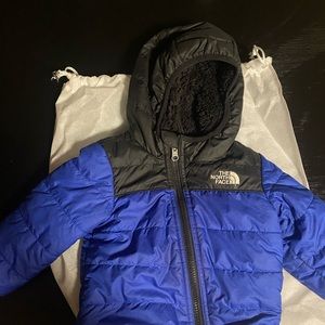 Infant North Face blue jacket reversible